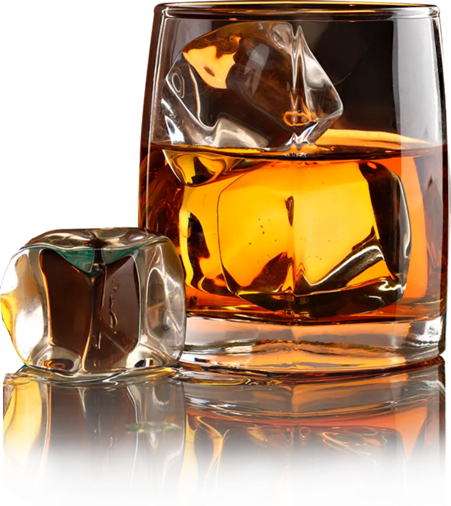 A glass of whisky with ice cubes.