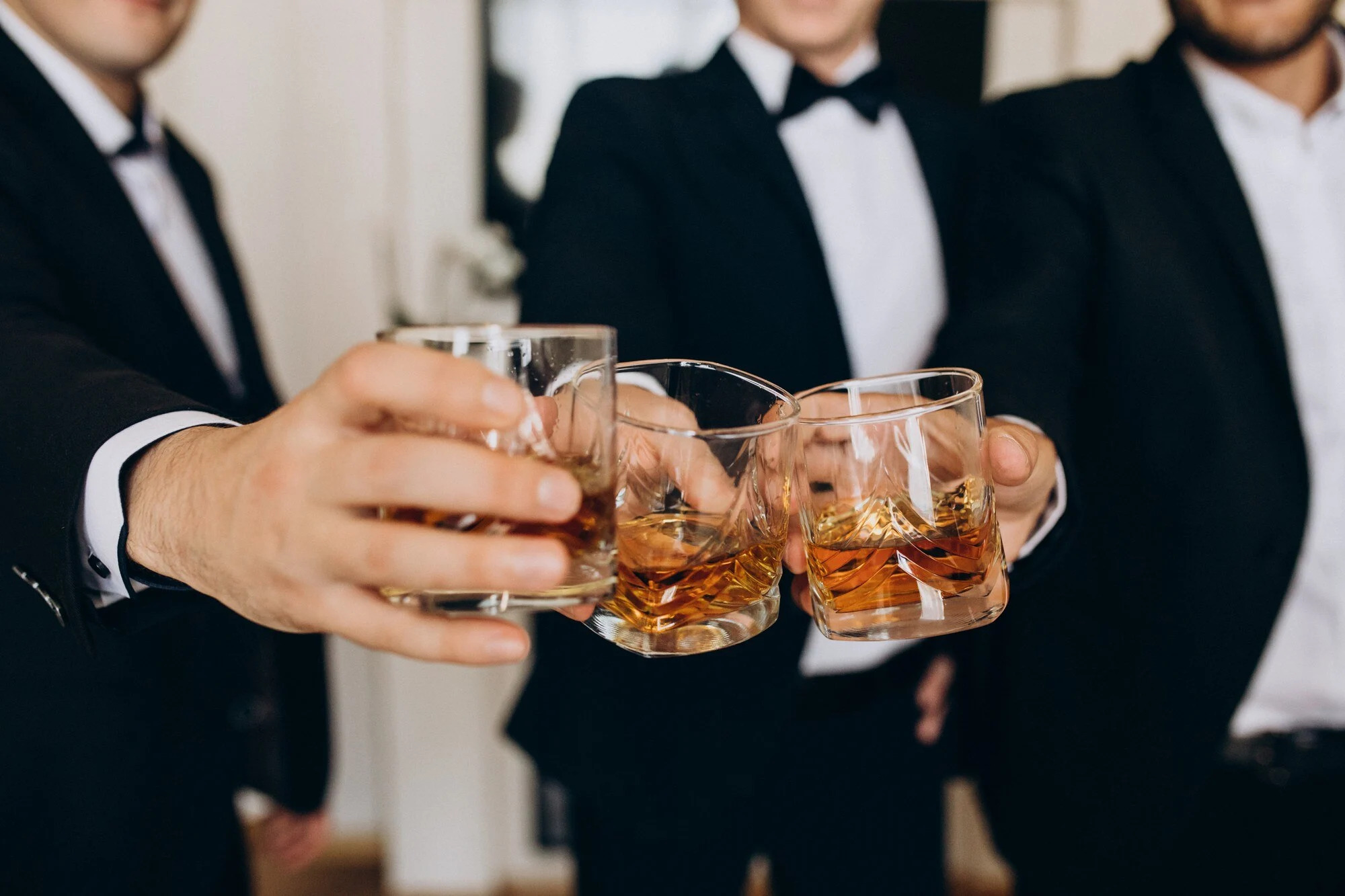 People with a glass of whisky in their hands.